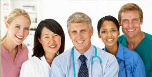 Picture of Physicians and Nurses smiling. (2 males and 3 females)
